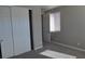 This is a bedroom with large closet and sunlit window at 2822 Poseidon Shore Ave, Henderson, NV 89052