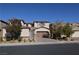 Charming two-story home features desert landscaping, brick driveway, and an attached two-car garage at 2822 Poseidon Shore Ave, Henderson, NV 89052
