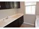 This laundry room has a sink, new washer, and modern cabinetry at 2822 Poseidon Shore Ave, Henderson, NV 89052