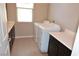 This laundry room has a new washer, dryer and modern cabinetry at 2822 Poseidon Shore Ave, Henderson, NV 89052