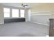 Open loft space with neutral carpet, ceiling fan, and built-in storage, perfect for a home office or play area at 2822 Poseidon Shore Ave, Henderson, NV 89052