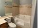 Bathroom featuring a tub-shower combo with tile surround, toilet, and vanity at 2967 Juniper Hills Blvd # 104, Las Vegas, NV 89142