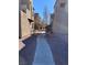 Exterior view of the building featuring stucco walls and a walkway at 2967 Juniper Hills Blvd # 104, Las Vegas, NV 89142