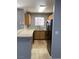 Traditional kitchen featuring tile flooring, window, and wooden cabinets at 2967 Juniper Hills Blvd # 104, Las Vegas, NV 89142