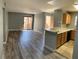 Spacious living room featuring gray flooring and open access to the kitchen at 2967 Juniper Hills Blvd # 104, Las Vegas, NV 89142