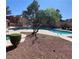 Inviting community pool and hot tub area surrounded by well maintained landscaping at 2967 Juniper Hills Blvd # 104, Las Vegas, NV 89142