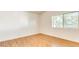 Bedroom with wood flooring, natural light from the large window at 3673 Ian Thomas St # 201, Las Vegas, NV 89129