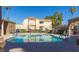 Community pool and courtyard on a clear day with a view of the building at 3673 Ian Thomas St # 201, Las Vegas, NV 89129