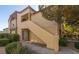 Charming condo with well-manicured landscaping, covered entryway, and private staircase to upper units at 3673 Ian Thomas St # 201, Las Vegas, NV 89129