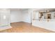 Inviting living space with wood floors, opening to the kitchen, and white walls for a clean modern feel at 3673 Ian Thomas St # 201, Las Vegas, NV 89129