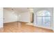 Bright living area boasting wood flooring, arched windows, and open layout, perfect for modern living at 3673 Ian Thomas St # 201, Las Vegas, NV 89129