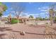 Home exterior highlighting pool with safety fence and desert landscaping at 3681 S Rosecrest Cir, Las Vegas, NV 89121