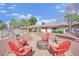 Backyard featuring desert landscaping, fire pit, and fenced swimming pool at 3681 S Rosecrest Cir, Las Vegas, NV 89121