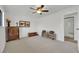 Spacious bedroom with neutral carpet, ceiling fan, and ample space for furniture arrangement at 3681 S Rosecrest Cir, Las Vegas, NV 89121