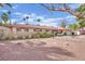 Well-kept single-story house with mature trees, desert landscaping, and a tidy exterior in a sunny setting at 3681 S Rosecrest Cir, Las Vegas, NV 89121