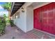 Charming home entrance with red double doors and textured exterior at 3681 S Rosecrest Cir, Las Vegas, NV 89121