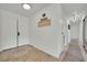 Hallway with a welcome sign, white walls, and tiled floors at 3681 S Rosecrest Cir, Las Vegas, NV 89121