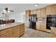 Spacious kitchen features stainless steel appliances, granite countertops, and a tile floor at 3681 S Rosecrest Cir, Las Vegas, NV 89121
