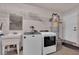 A clean laundry room includes a washing machine, dryer, sink, and water heater at 3681 S Rosecrest Cir, Las Vegas, NV 89121