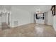 Bright living room with travertine tile, window, and natural light at 3681 S Rosecrest Cir, Las Vegas, NV 89121