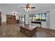 Open living room featuring tile flooring, ceiling fan, and natural light throughout at 3681 S Rosecrest Cir, Las Vegas, NV 89121