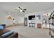 Cozy living room features a ceiling fan, neutral carpet and paint, and seamless access to adjoining spaces at 3681 S Rosecrest Cir, Las Vegas, NV 89121