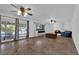 Spacious living room features tile floors, fireplace, and sliding doors to pool at 3681 S Rosecrest Cir, Las Vegas, NV 89121