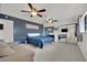 Spacious bedroom with ceiling fans, and mirrored closet at 3681 S Rosecrest Cir, Las Vegas, NV 89121