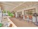 Spacious covered patio with outdoor seating and a charming decorative fan at 3681 S Rosecrest Cir, Las Vegas, NV 89121