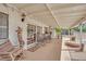 Covered patio with ample seating, ideal for entertaining or relaxing outdoors at 3681 S Rosecrest Cir, Las Vegas, NV 89121