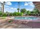 Beautiful pool area surrounded by lush landscaping, rocks, and privacy fencing at 3681 S Rosecrest Cir, Las Vegas, NV 89121