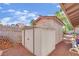 Exterior view of a backyard shed with double doors, offering extra storage space at 3681 S Rosecrest Cir, Las Vegas, NV 89121