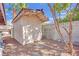 Storage shed located in the backyard with decorative rock landscape at 3681 S Rosecrest Cir, Las Vegas, NV 89121