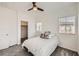 Well-lit bedroom with plush carpet, two large windows and an adjoined closet at 3693 Canis Minor Ln # 13101, Henderson, NV 89052