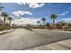 The community entrance features desert landscaping and palm trees at 3693 Canis Minor Ln # 13101, Henderson, NV 89052