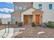 Charming townhome with well-maintained landscaping and a welcoming entrance with two doors at 3693 Canis Minor Ln # 13101, Henderson, NV 89052
