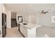 Modern kitchen with white cabinets and large island, perfect for entertaining at 3693 Canis Minor Ln # 13101, Henderson, NV 89052