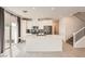Modern kitchen with white cabinets, stainless steel appliances, and a large center island at 3693 Canis Minor Ln # 13101, Henderson, NV 89052