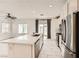 Modern kitchen boasts stainless steel appliances, white cabinets, and a large island at 3693 Canis Minor Ln # 13101, Henderson, NV 89052
