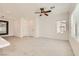 Open concept living room with a modern ceiling fan and chandelier lighting at 3693 Canis Minor Ln # 13101, Henderson, NV 89052