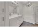 Bright bathroom featuring double sink vanity, bathtub, shower, and modern fixtures at 3975 N Hualapai Way # 235, Las Vegas, NV 89129