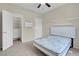 This bedroom offers neutral tones, with an open closet and a door to the hallway at 3975 N Hualapai Way # 235, Las Vegas, NV 89129
