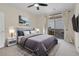 Nicely staged bedroom with outside balcony access, and neutral decor at 3975 N Hualapai Way # 235, Las Vegas, NV 89129