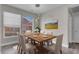 Formal dining room with large picture window and stylish chandelier lighting at 3975 N Hualapai Way # 235, Las Vegas, NV 89129