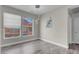 Light and airy bonus room with wood-look floors and a large picture window at 3975 N Hualapai Way # 235, Las Vegas, NV 89129