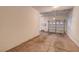 Clean and bright garage featuring a white garage door and ample space at 3975 N Hualapai Way # 235, Las Vegas, NV 89129