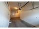 Functional garage with door and lighting fixtures for easy access and storage at 3975 N Hualapai Way # 235, Las Vegas, NV 89129