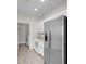 Modern kitchen with stainless steel appliances and access to laundry room at 3975 N Hualapai Way # 235, Las Vegas, NV 89129