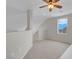Upstairs open loft area with neutral carpet and window, perfect for a bonus space at 3975 N Hualapai Way # 235, Las Vegas, NV 89129