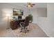 Home office features a desk, comfortable chair, area rug, and decorative lighting for a professional workspace at 3975 N Hualapai Way # 235, Las Vegas, NV 89129